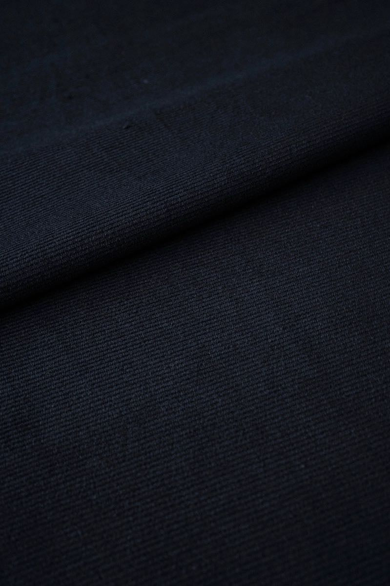 A close-up of fabric, revealing the delicate weave and beautiful texture of the natural material.
