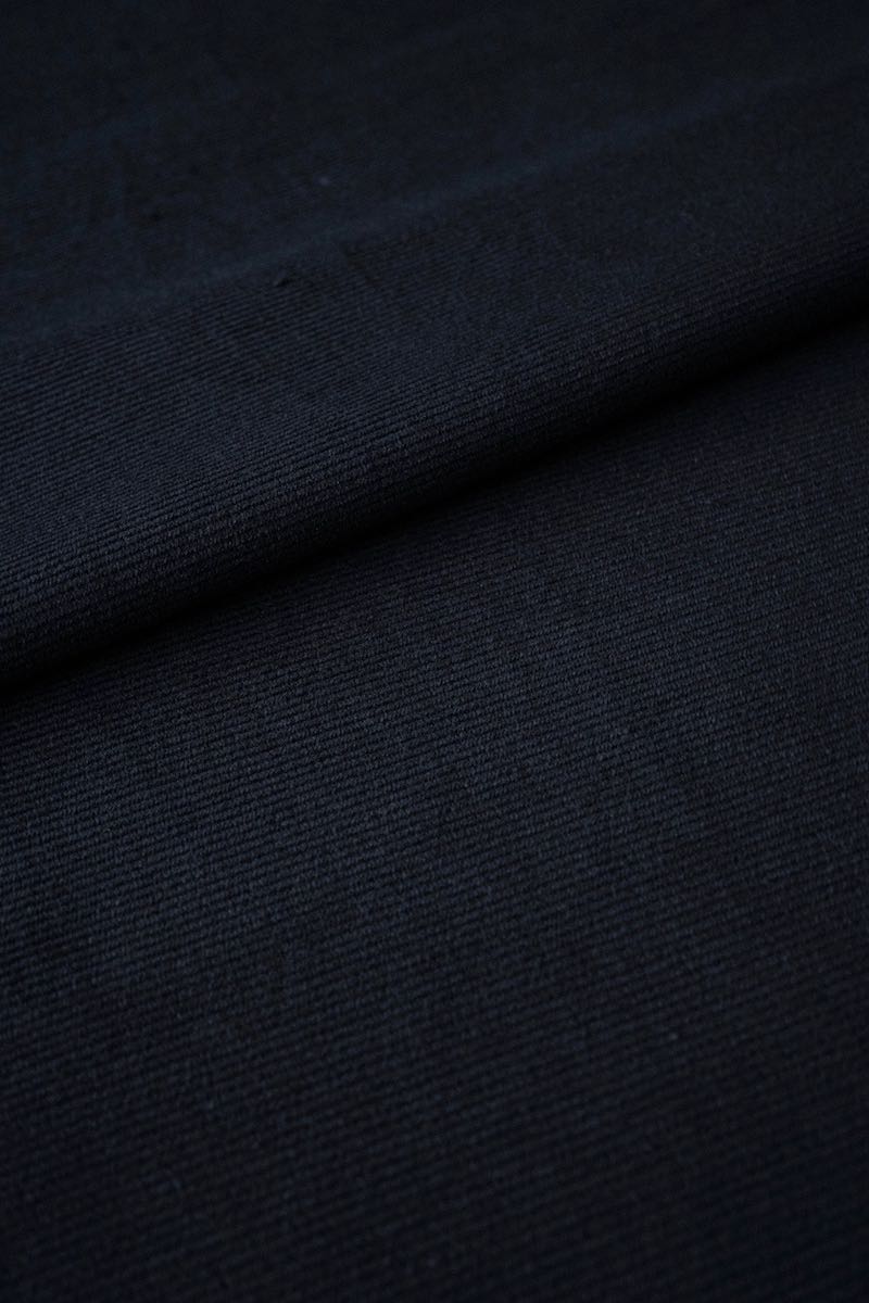 A close-up of fabric, revealing the delicate weave and beautiful texture of the natural material.