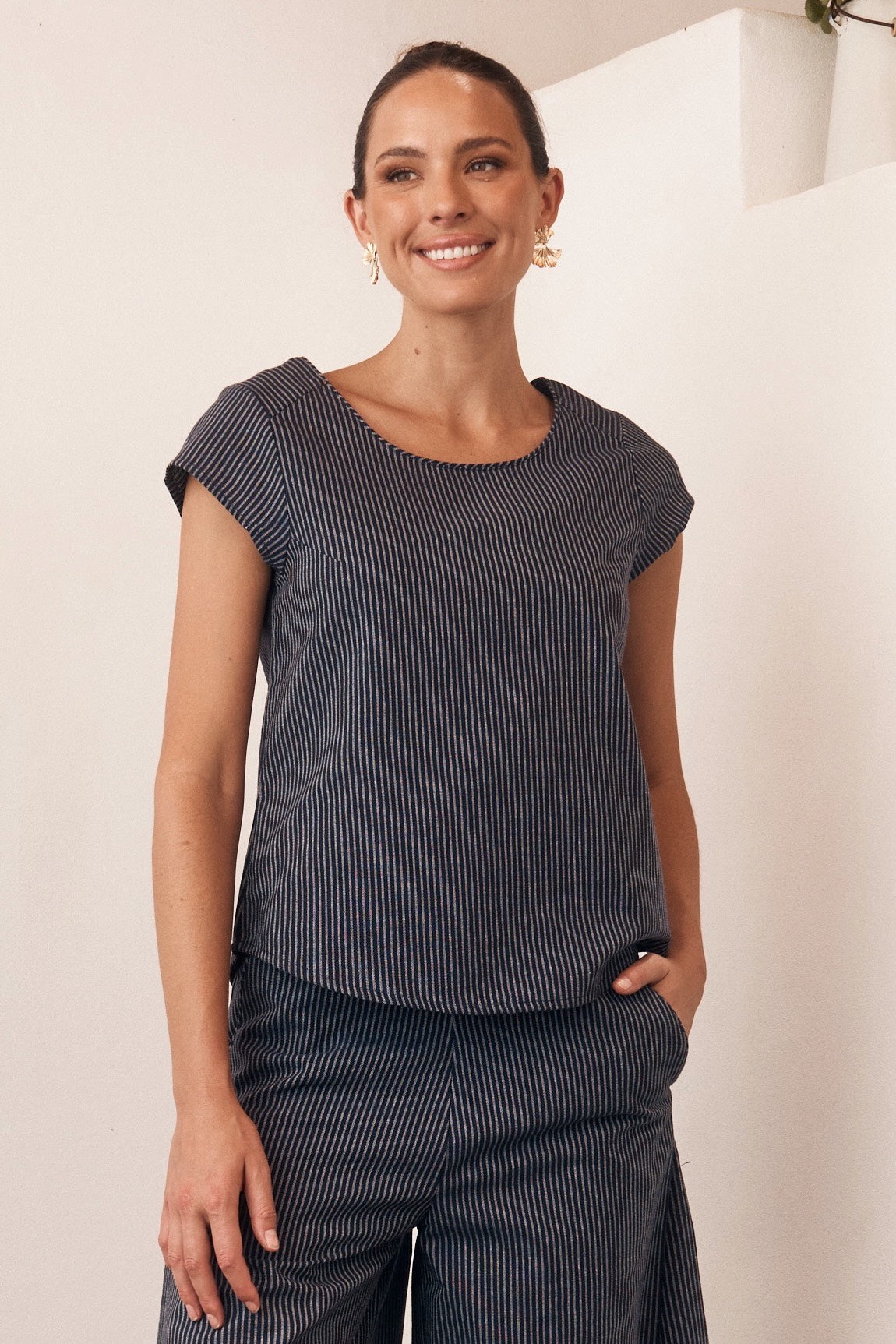 Floral printed sleeveless dress displayed on a mannequin.