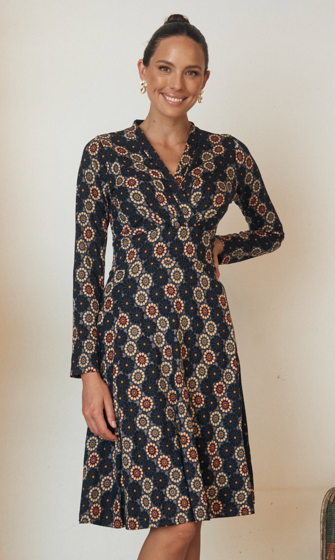 A minimalistic yet striking dress in a neutral tone, with soft, organic lines that enhance its simple beauty.