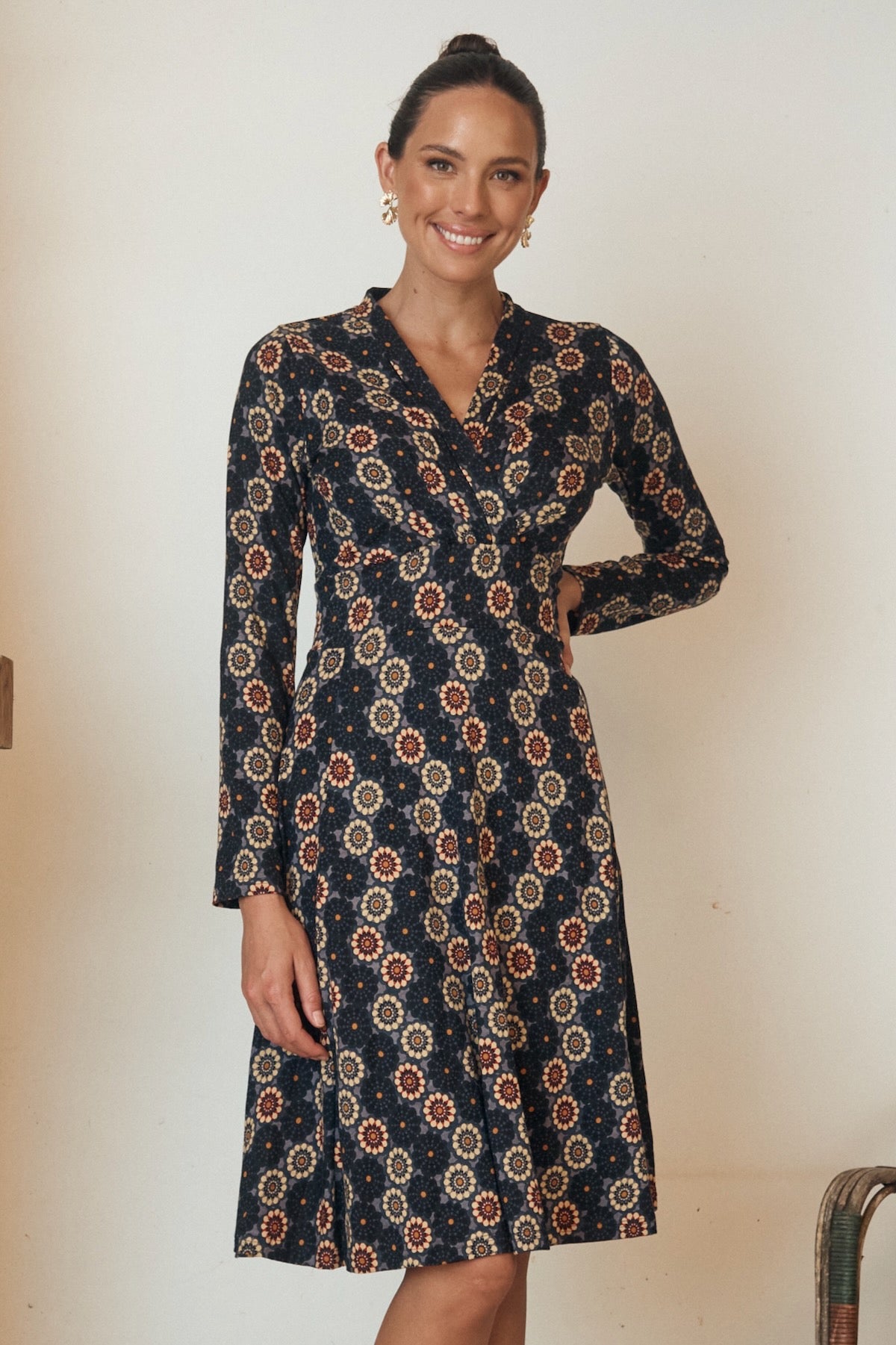 A minimalistic yet striking dress in a neutral tone, with soft, organic lines that enhance its simple beauty.