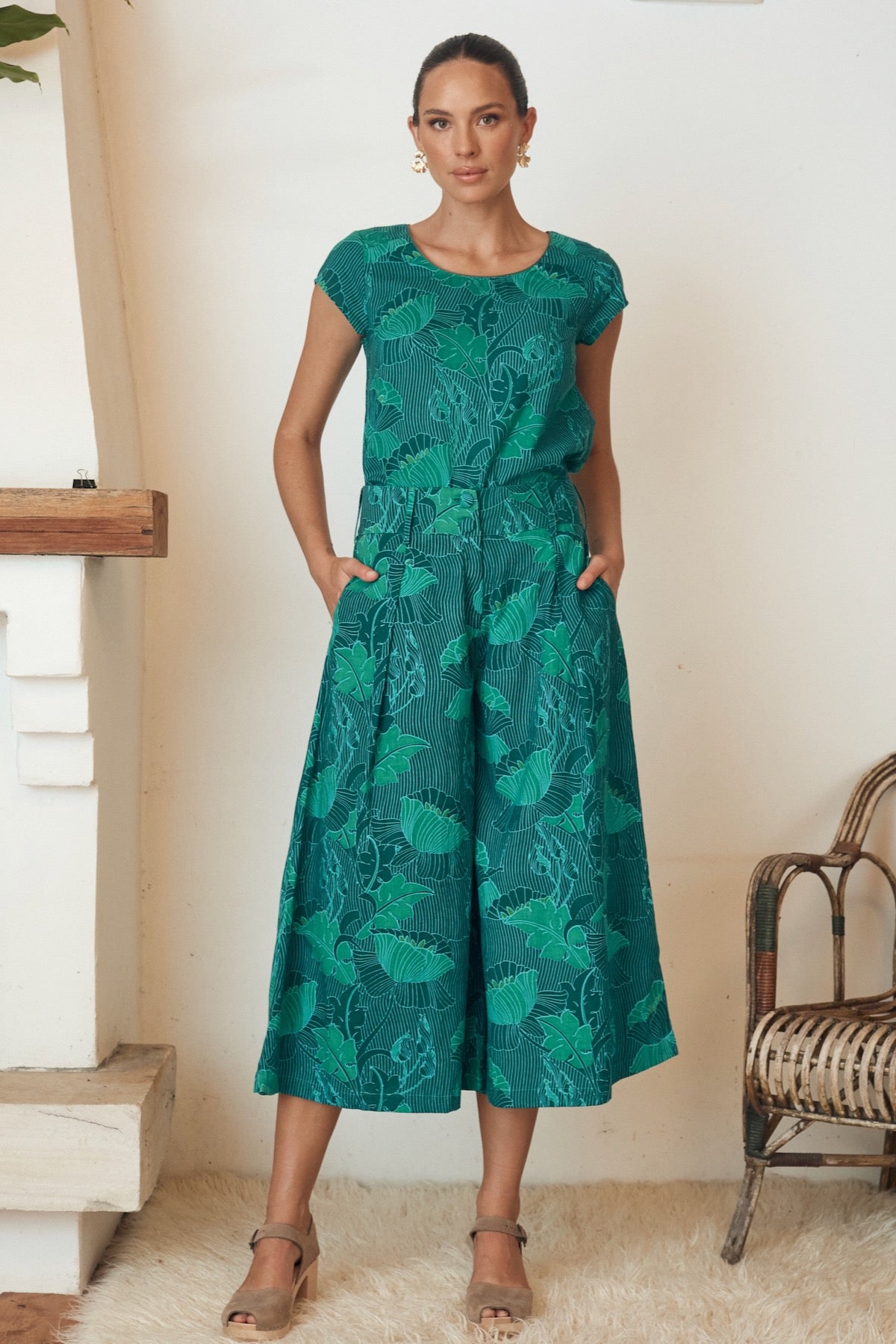 Stylish floral print dress with long sleeves, displayed on a mannequin.