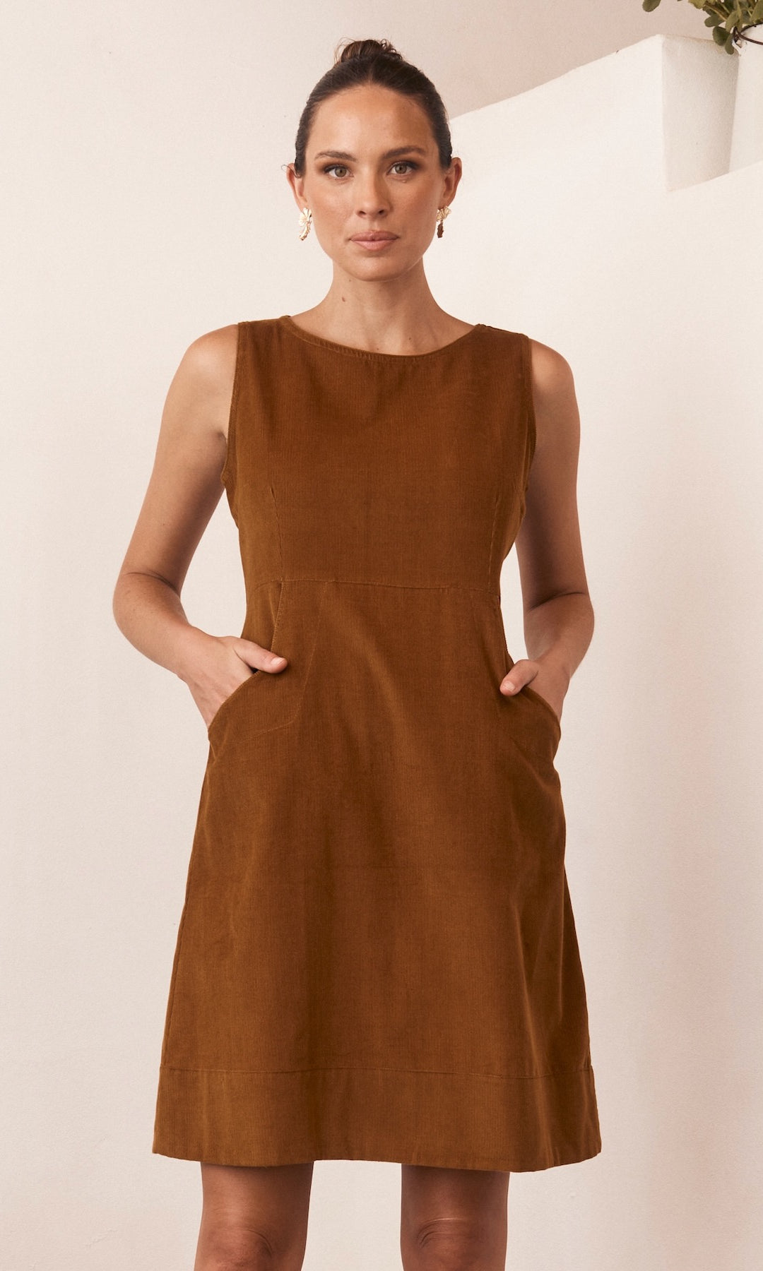 A lightweight summer dress displayed against a bright, natural backdrop, exuding effortless style and comfort.