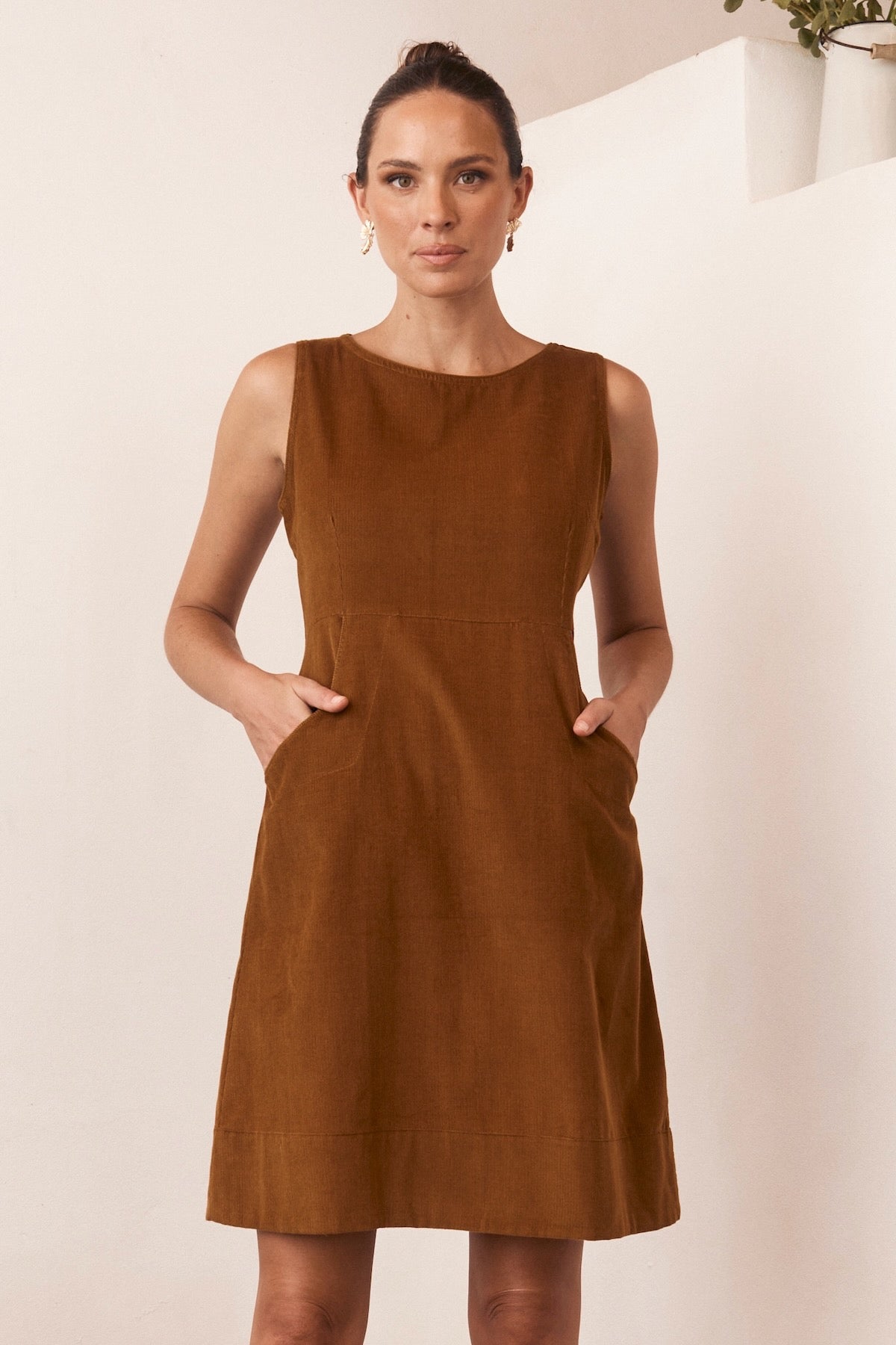 A lightweight summer dress displayed against a bright, natural backdrop, exuding effortless style and comfort.