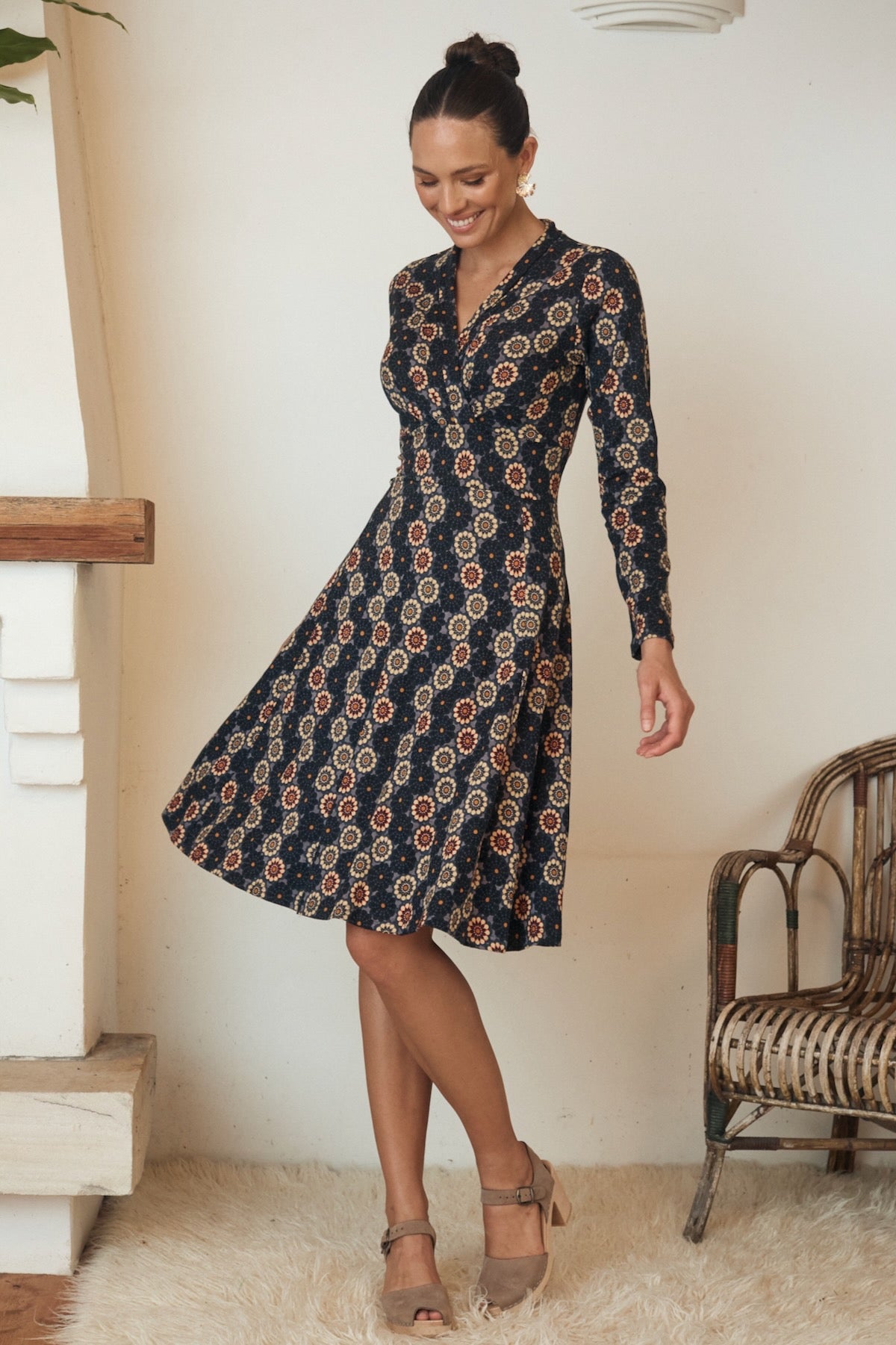 A graceful, flowy dress draped over a mannequin, its natural fibers catching the light in a subtle yet sophisticated manner.