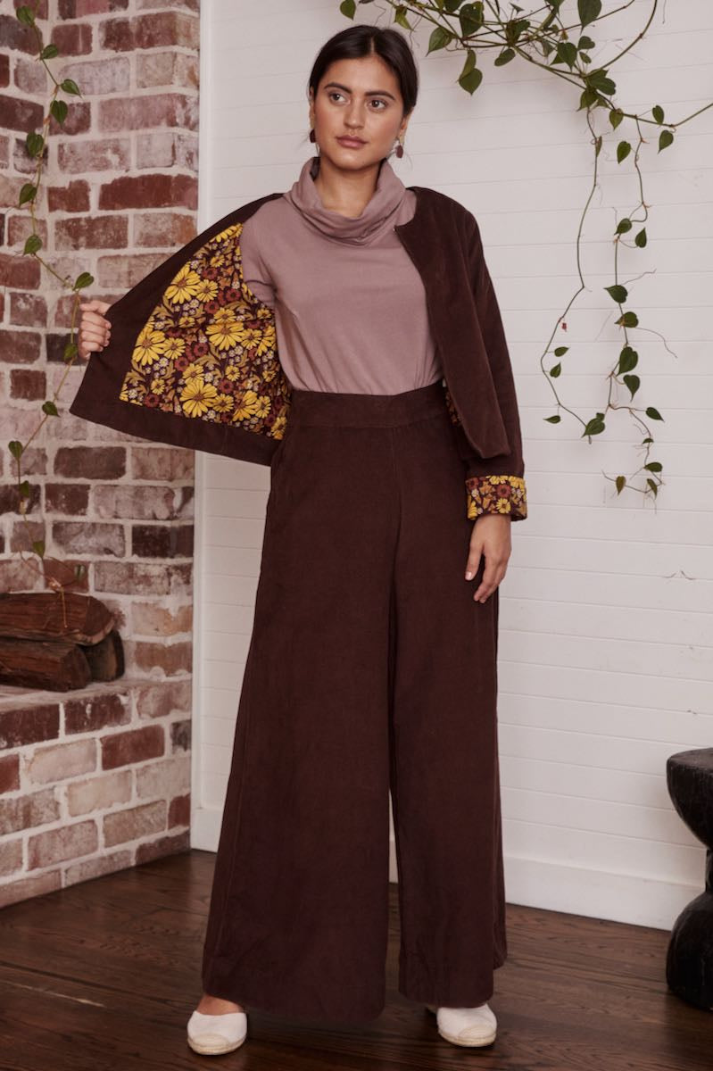 A casual, bohemian-style dress on a model, with the natural fabric swaying gently in the breeze.