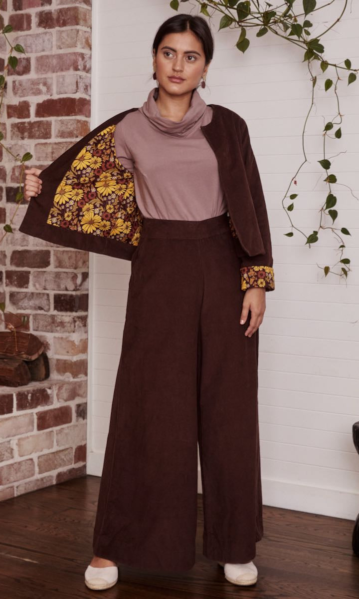 A casual, bohemian-style dress on a model, with the natural fabric swaying gently in the breeze.