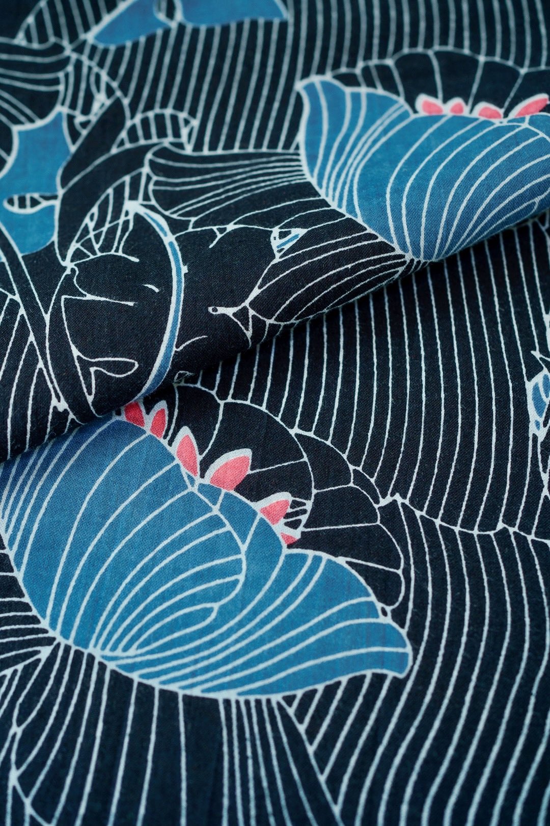 A woman confidently wearing a stylish dress, its flowing fabric captured in mid-motion, evoking a carefree, summery feel.