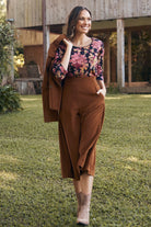 A gorgeously textured fabric swatch, its intricate details highlighted by the gentle lighting.